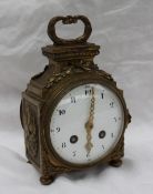 A 19th century French ormolu desk clock, with a leafy scrolling handle,