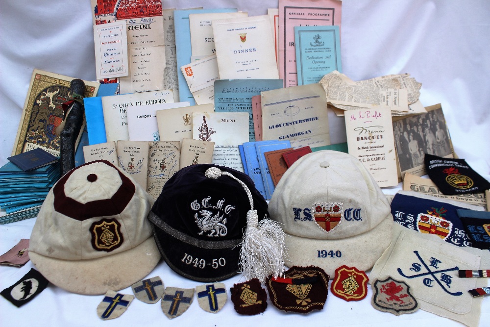 A Collection of sporting caps including a purple velvet example with silver thread sewn with a