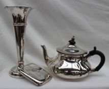 An Edward VII silver teapot of squat circular form, London, 1907,