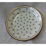 A Swansea porcelain plate, decorated with single cornflowers to a double gilt ring border,