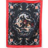 A Chinese silk wall hanging / throw, decorated with dragons flowers and leaves,