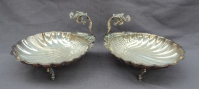 A pair of continental white metal shell shaped dishes,