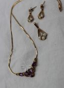 A 9ct yellow gold necklace together with five pear shaped amethysts,