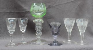 A pair of 19th century wine glasses with tapering bowls on a octagonal tapering stem and spreading