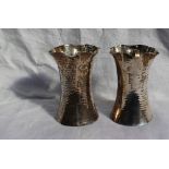 A pair of George V silver vases of flared form with hammered decoration, Sheffield, 1910, Martin,