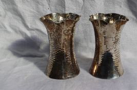 A pair of George V silver vases of flared form with hammered decoration, Sheffield, 1910, Martin,