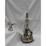 An electroplated table centrepiece with an engraved glass trumpet above a shallow glass dish,