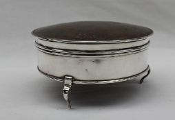 A George V silver trinket box of circular form with a faded tortoiseshell lid, London, 1917,