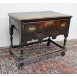 An 18th century and later lowboy the rectangular planked top above a drawer and shaped frieze on