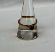 A solitaire black diamond ring, approximately 0.