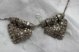 An Art Deco diamond double clip brooch converted to a necklace,