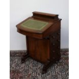 A Victorian walnut davenport,