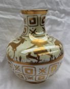 A Royal Doulton pottery vase decorated with fairies and stags to a cream ground, 18.