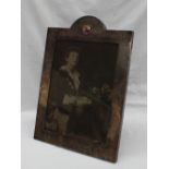 A large George V silver photograph frame,