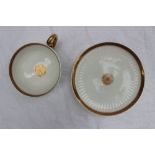 A Swansea Paris flute cup and saucer, with a ribbed body and gilt rims,