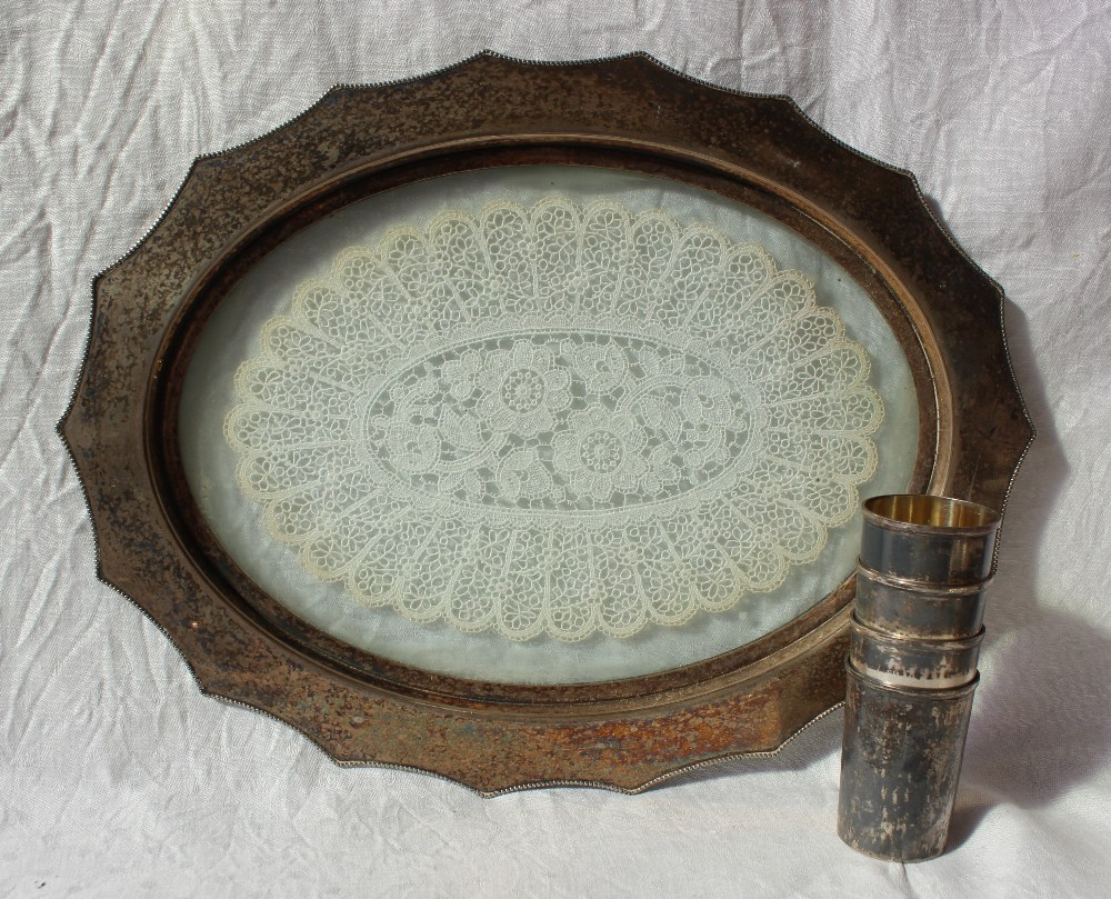 A WMF white metal dressing table tray with a shaped beaded edge and glazed base,
