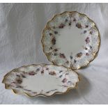 A pair of Royal Crown Derby plates, with a flared rim,