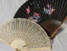 A bone and silk fan with white metal decoration, 20.
