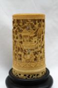 A 19th century Cantonese ivory brush pot carved and pierced with figures, trees,