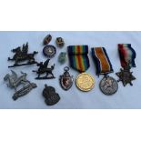 Three World War I medals including the War Medal, Victory Medal and 1914-15 Star,