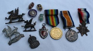Three World War I medals including the War Medal, Victory Medal and 1914-15 Star,