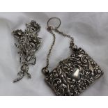 An Edward VII silver purse embossed with birds, scrolls flowers and leaves, Chester 1904,
