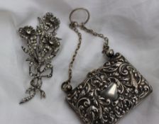 An Edward VII silver purse embossed with birds, scrolls flowers and leaves, Chester 1904,