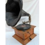 An oak cased ‘Dulcephone’ table top gramophone with a black lacquer tin plate horn,