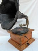 An oak cased ‘Dulcephone’ table top gramophone with a black lacquer tin plate horn,