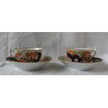 A pair of 19th century English porcelain tea cups and saucers,