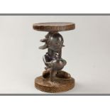 A 20TH CENTURY BELGIAN CONGO FIGURAL STOOL the figural African stool decorated with beads around the