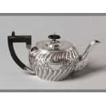 A GEORGE V SILVER TEAPOT SHEFFIELD 1929, possibly W.W.H hinged top with removable fruitwood