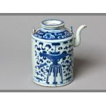 A 19TH CENTURY PROVINCIAL TEAPOT decorated in under-glazed blue depicting precious objects, the