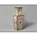 A FINE LARGE CHINESE FAMILLÉ ROSE VASE decorated with panels of “precious objects” in high relief,