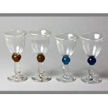 A SET OF FOUR SHIRLEY CLOETE WINE GLASSES hand moulded, different sizes, base signed and dated ’