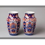 A PAIR OF 19TH CENTURY JAPANESE IMARI OPEN NECK VASES with four panels depicting flowers between