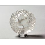 A RENÉ LALIQUE CIRCULAR SHAPED GLASS PLAQUE depicting a dove in a wreath, base signed Lalique,