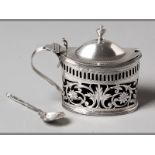 A VICTORIAN SILVER MUSTARD POT CHESTER 1898, G.N. hinged top with thistle form finial, applied C-