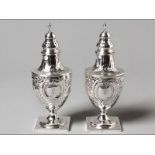 A PAIR OF GEORGE III SUGAR CASTORS LONDON 1800, CHARLES CHESTERMAN II removable pierced tops, urn