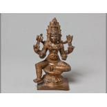 A 19TH CENTURY COPPER-BRONZE FIGURE OF A SEATED DEITY possibly Indian, the graceful deity superbly