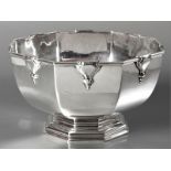 A GEORGE V SILVER BOWL, LONDON 1914, W.C., fold-over rim, with applied urn decoration on each