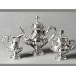 A THREE PIECE CONTINENTAL .800 STD SILVER COFFEE SET, comprising: Coffee pot, teapot, creamer and