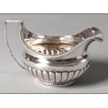 A GEORGE III SILVER CREAMER, LONDON 1802, PETER, ANN & WILLIAM BATEMAN, gadrooned rim, C-form