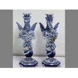 A PAIR OF FAIENCE GRIFFON CANDLESTICK