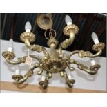 AN 8-LIGHT CAST BRASS CHANDELIER