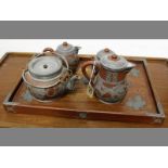 A FOUR PIECE CHINESE TERRACOTTA TEA SERVICE ON TRAY