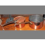 TWO 19TH CENTURY COPPER & IRON SAUCE PANS, 64cm & 51cm long