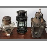 THREE STORM LANTERNS OF VARIOUS SHAPES