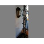 A WROUGHT IRON AND GLASS STANDING LAMP, 180cm high, & A BRASS WALL LAMP (2)