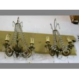 A PAIR OF BRASS AND CRYSTAL WALL SCONCES